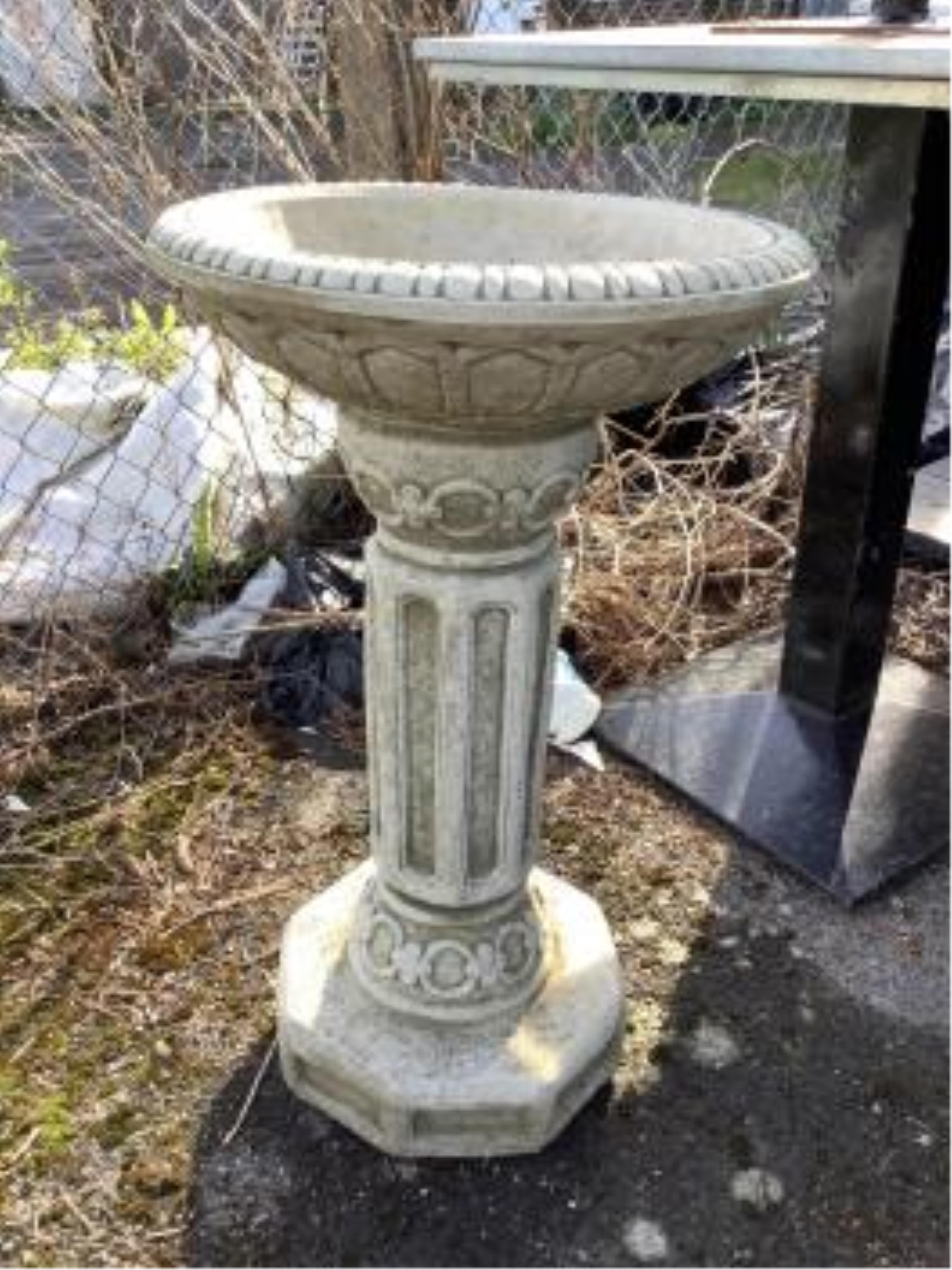 A Sparta Statues reconstituted stone pedestal bird bath, height 58cm, a more ornate larger bird bath, height 67cm and a reconstituted stone figural bird bath, width 46cm. Condition - pedestal bird baths fair to good, fig